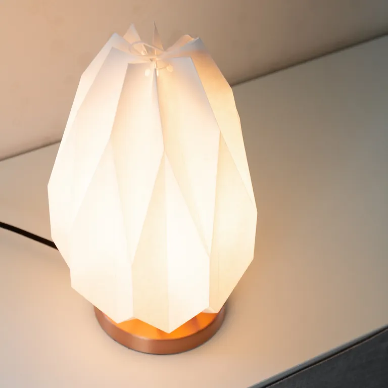 Origami lamp on a cabinet